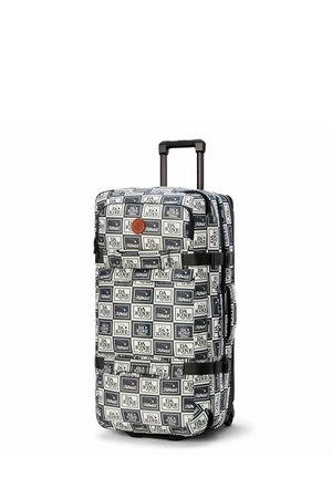 Soft-shell luggage with a repeating black and white graphic pattern, featuring a retractable handle and wheels for mobility. Hexagonal zipper details.