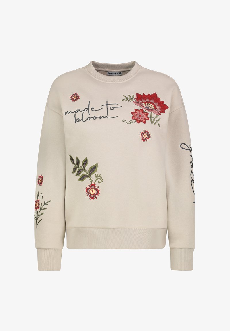 Beige Sweatshirt mit gestickten roten Blumen, grünen Blättern und dem Text "made to bloom". Rippbündchen und Saum. Weiches, strukturiertes Material.