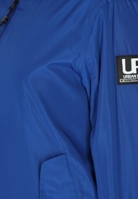 Schmuddelwedda urban rain - Bomber tipa jaka - royalblau