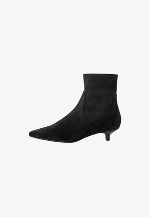 Black suede ankle boots with a pointed toe and low kitten heel. Seamless design with a smooth texture, featuring a soft finish.