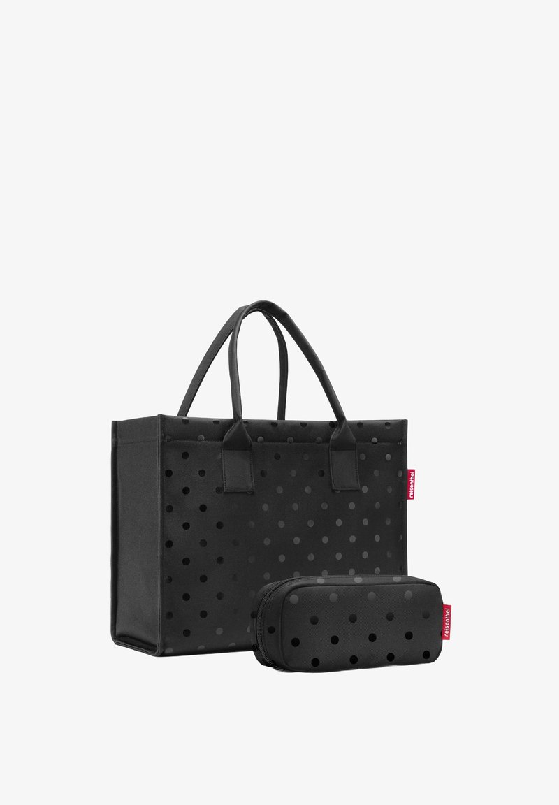 Sac en toile noir avec de grands pois, doté de deux poignées solides. Comprend une trousse à crayons zippée assortie au design similaire.