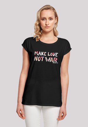 Black t-shirt with short sleeves featuring the text "MAKE LOVE NOT WAR" in varied colors and patterns. Smooth cotton fabric, relaxed fit.