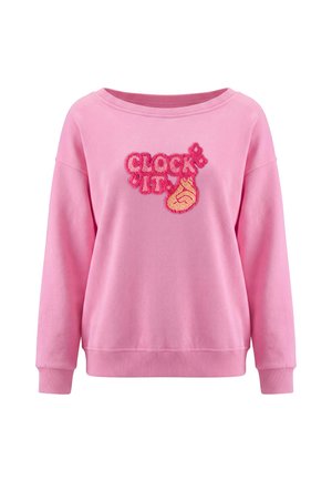 Lyserød sweatshirt med lange ærmer og et design med teksten "CLOCK IT" og en hånd, der viser fingerknips på brystet.