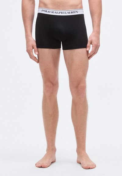 Cuecas boxer pretas feitas de tecido macio, com cós elástico branco com o logótipo "POLO RALPH LAUREN", design ajustado e comprimento curto das pernas.