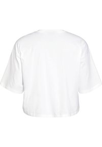 White cropped t-shirt made of soft cotton. Features short sleeves and a simple, clean design with a round neckline. No patterns or hardware.