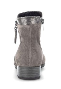 Gray suede ankle boot with a metallic silver patterned cuff, back zipper closure, and a textured block heel. Smooth interior lining.