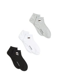 Three pairs of ankle socks: black, white, and grey. Each features small cartoon face with sunglasses and logo. Cotton blend material.