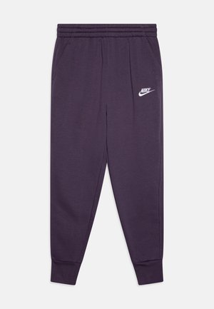Purple Nike joggers featuring an elastic waistband, side pockets, and a white logo on the left thigh. Soft, smooth fabric with tapered legs.