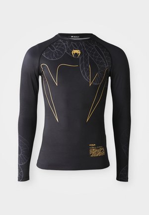 Long-sleeve rash guard in black, featuring a snake design in gold, smooth texture, elastic fit, and a logo printed at the bottom.