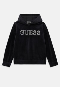 Crna baršunasta hoodie s visokim ovratnikom i dugim rukavima. Sadrži „GUESS“ u cirkonima sprijeda. Mekana tekstura s ležernim krojem.