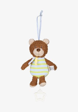 Brauner Teddybär mit gestreiftem gelb-grünem Outfit, hängt an einer Schlaufe und zieht an einem weißen, sternförmigen Kunststoffgriff darunter.