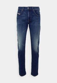 Smal passform mörkblå denimjeans med en urtvättad finish, femfickorsdesign, silverfärgade detaljer och subtila sömnadsdetaljer på sömmarna.
