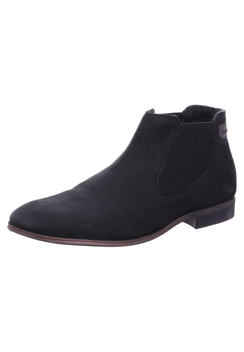 Bottine Chelsea en daim noir avec panneaux latéraux élastiques texturés, bout amande élégant et petit talon empilé. Marque discrète sur le talon.