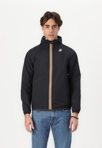 Black windbreaker jacket with a yellow and blue front zipper, elastic cuffs, and a hood, made of lightweight material.