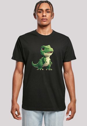 Black t-shirt featuring a colorful cartoon dinosaur print in green, with detailed eyes, a textured body, and a playful pose.