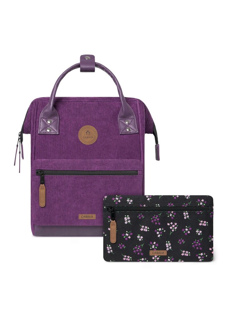 Purple corduroy backpack with leather accents and a logo patch; includes a black floral-patterned pouch with a zipper closure.