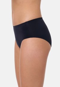 Mutande hipster nere senza cuciture, con finitura liscia, design a vita media e senza cuciture visibili. Tessuto morbido adatto per un comfort duraturo.
