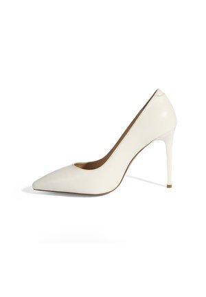 White leather high-heeled pump with pointed toe, sleek design, and a smooth texture. Features a thin stiletto heel and minimalistic accents.