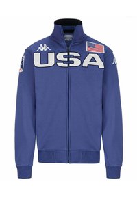 Giacca zip-up blu con grande scritta "USA" in bianco. Presenta un colletto alto, polsini a coste e un patch della bandiera americana sulla spalla.