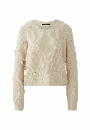 Beige gebreid sweatshirt met rafelige randen en ruitpatroon, voorzien van zilverkleurige oogjes en een ronde hals. Textuur en ontspannen pasvorm.