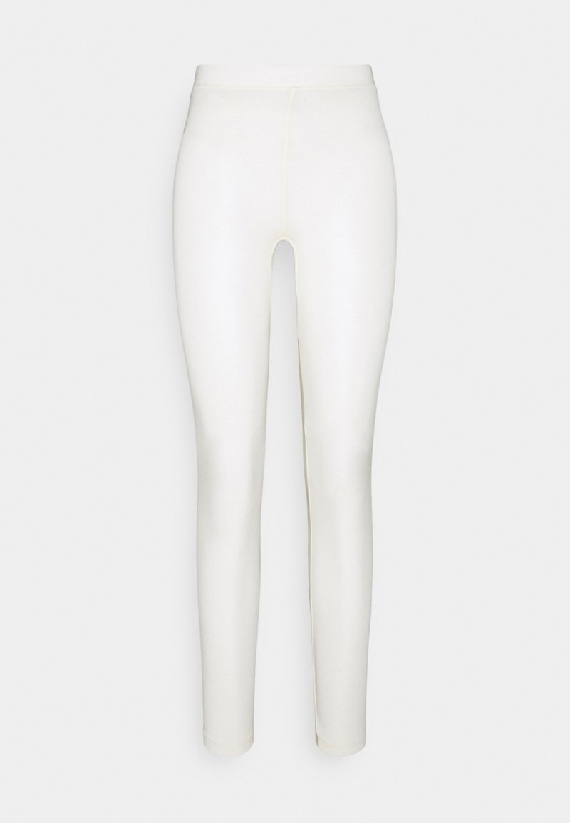 Vita leggings med en slät, elastisk textur och hög midja, med en sömlös design och åtsittande stil ner till anklarna.