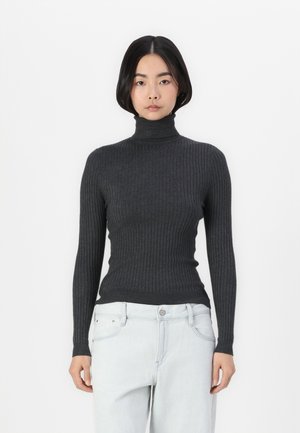 Donkergrijze geribbelde coltrui met lange mouwen, met een aansluitend ontwerp en een gestructureerde stof. Gecombineerd met lichte denim jeans.