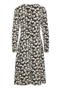 Robe noire à manches longues avec motif floral écru, taille ajustée et jupe longueur genou.