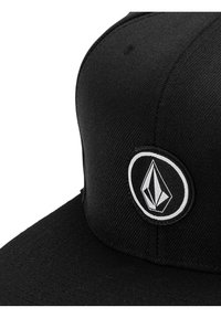Casquette noire en tissu texturé, ornée d'un logo rond avec un design géométrique en blanc. La visière a une légère courbure.