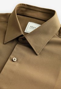 Next Ing - neutral brown