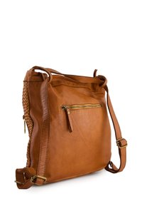Tan leather crossbody bag with woven side detail, zippered front pocket, adjustable strap, and smooth texture.