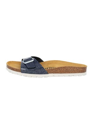 Mule bleu marine avec texture pailletée, boucle ajustable, semelle en liège et semelle en caoutchouc blanche. Design plat pour un enfilage facile.