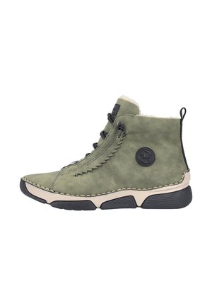 Green suede ankle boot with black rubber sole, side stitching, lace-up front, logo patch, and pull tab at the heel.