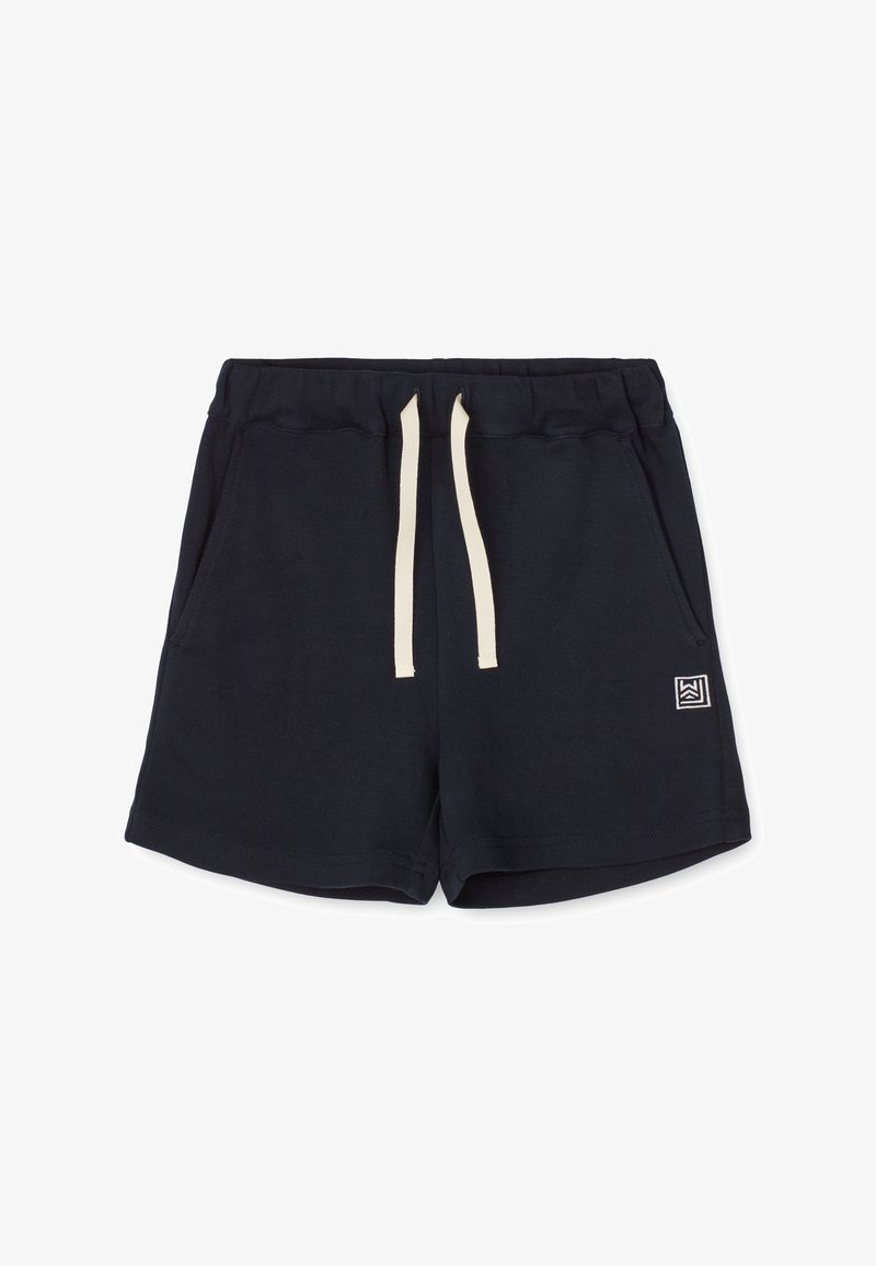 Shorts décontractés noirs avec ceinture élastique, cordons crème, poches latérales et petite étiquette logo blanche sur la jambe gauche.