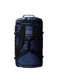 Zaino a duffel blu navy realizzato in tessuto resistente, con spallacci neri, una maniglia superiore e un pannello decorativo testurizzato.