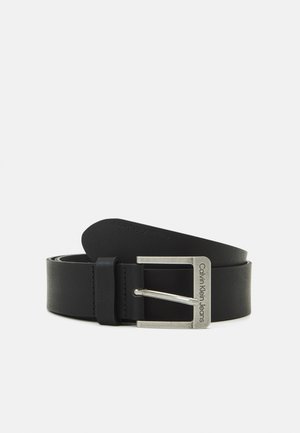 Black leather belt with a flat design, a silver rectangular buckle featuring engraved "Calvin Klein Jeans," and a smooth texture.