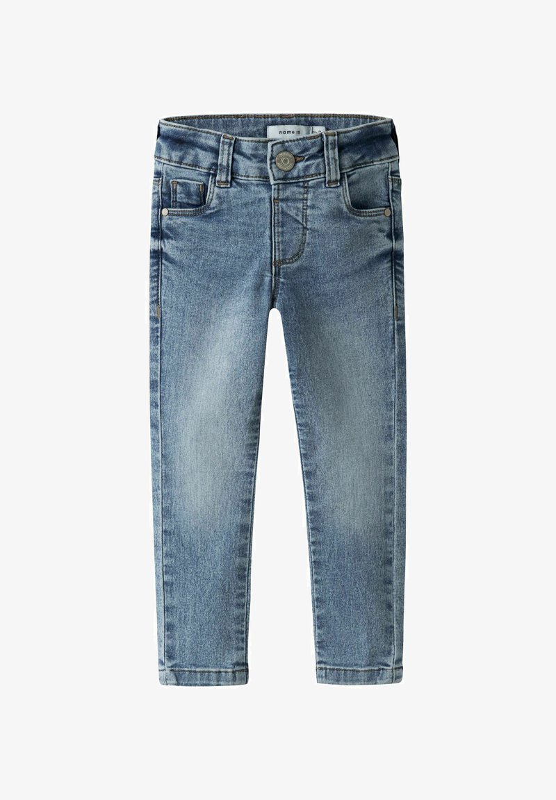 Skinny jeans i lyseblå denim med en falmet finish. Har fem lommer, knaplukning og bæltestropper rundt om taljen.