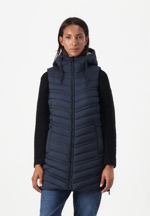Gilet matelassé navy avec coutures verticales, fermeture éclair à l'avant et capuche. Présente un design à manches longues en tricot texturé noir sur les côtés.