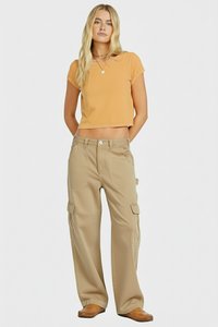 Beige cargo pants with multiple pockets, paired with a cropped orange t-shirt. Smooth fabric, relaxed fit, and simple design elements.