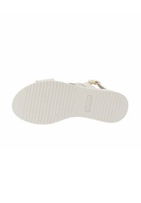 Sole di sandalo di colore chiaro realizzata in un materiale simile alla gomma con una texture. Presenta motivi scanalati e una leggera curvatura nella zona delle dita per il comfort.