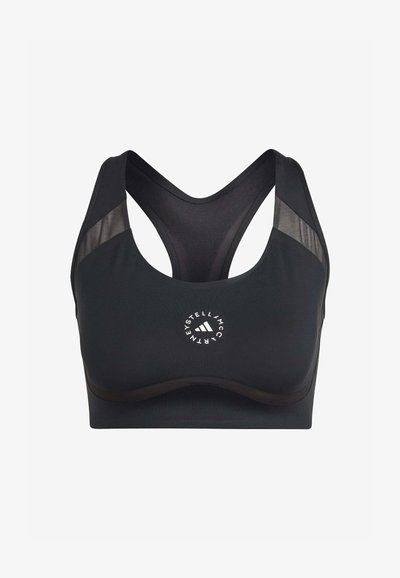 Melnā sporta krūšturis ar teksturētu audumu, sacensību atpakaļ dizainu un sieta akcentiem. Iekļauta logo centrā un gluda, noapaļota apakšmalā.