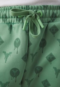 Carlo Colucci TRACKSUIT PANT UNISEX - Tréningruha alsók - light green