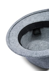 Gray felt hat with a wide, rounded brim and textured surface; features a black inner band and a care label inside. One size.