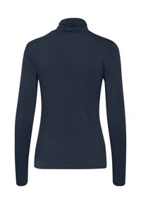 Chemise à col roulé manches longues bleu marine vue de dos avec une silhouette ajustée et sans motifs ni logos visibles.