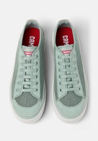 Mint green sneakers featuring mesh fabric, rounded toe, and white rubber sole. Red "CAMPER" logo on tongue. Laces evenly spaced.