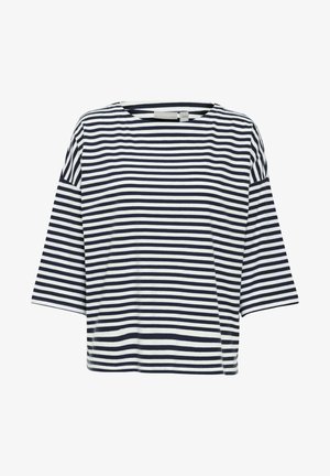 Csíkos póló sötétkék és fehér színben. Lazább fazon, rövid ujjakkal és kerek nyakkivágással. Puha, könnyű pamut anyag.