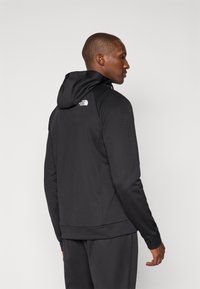 The North Face REAXION HOODED FULL ZIP JACKET - Športna jakna/jopica - black heather