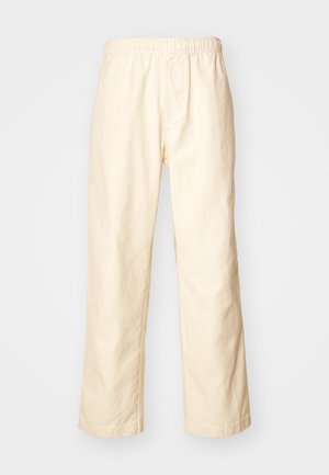 Beige cotton relaxed-fit pants with an elastic waistband, straight legs, and no visible patterns or hardware details.