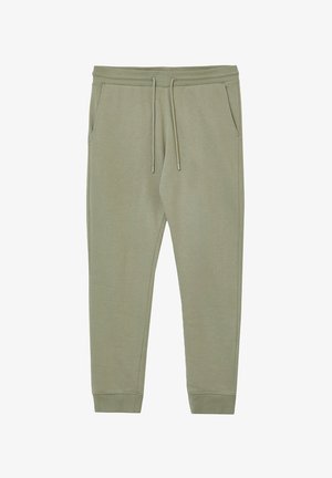 Jogging en coton kaki avec taille élastique, deux poches latérales et poignets fuselés, présentant une texture lisse et un design simple.