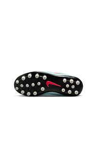 Semelle d'une chaussure à crampons de football Nike avec une base noire, des crampons blancs et un logo Nike rose bien visible, mettant en avant un design de traction pour les athlètes.