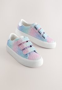 Low-top sneakers with pastel pink, purple, and blue glitter finish, three velcro straps, and thick white textured soles on a neutral background.